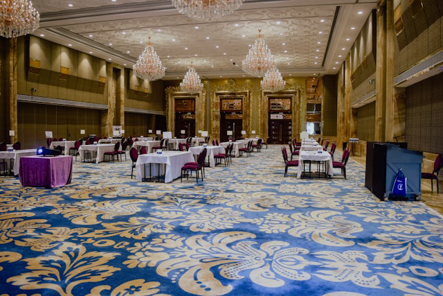 A grand ballroom set up for a corporate event or wedding reception.